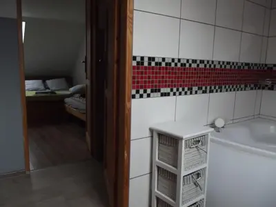 Łóżko lub łóżka w pokoju w obiekcie Siedlisko nad Stawem