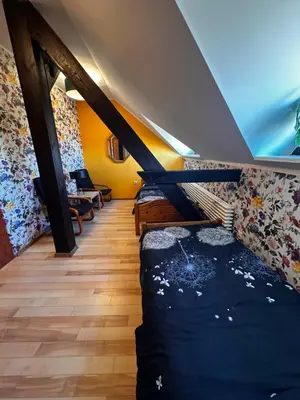 Łóżko lub łóżka w pokoju w obiekcie Gościniec Borki Wielkie