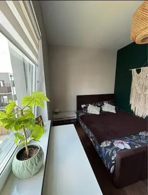 Łóżko lub łóżka w pokoju w obiekcie Apartament Cztery Pory Roku