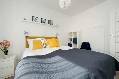 Łóżko lub łóżka w pokoju w obiekcie Wyjątkowy Apartament z Parkingiem by Noclegi Renters