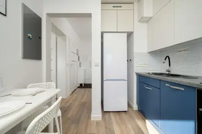 Kuchnia lub aneks kuchenny w obiekcie Wyjątkowy Apartament z Parkingiem by Noclegi Renters