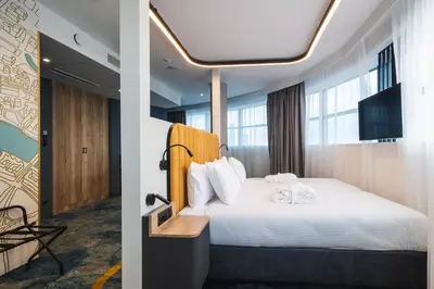 Łóżko lub łóżka w pokoju w obiekcie Focus Hotel Premium Wrocław