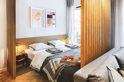 Łóżko lub łóżka w pokoju w obiekcie Luksus w Centrum Wrocławia