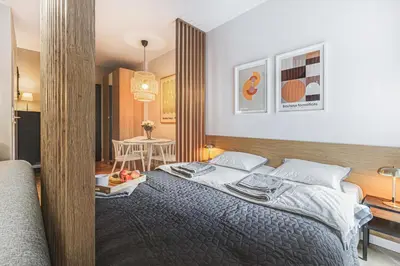 Łóżko lub łóżka w pokoju w obiekcie Luksus w Centrum Wrocławia