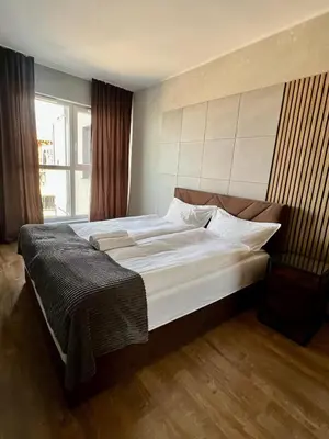 Łóżko lub łóżka w pokoju w obiekcie Intelliparts Q