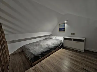 Łóżko lub łóżka w pokoju w obiekcie Apartamenty nad Kamiennym Potokiem 2