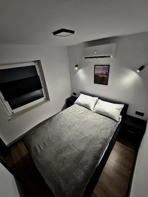 Łóżko lub łóżka w pokoju w obiekcie Apartamenty nad Kamiennym Potokiem 1