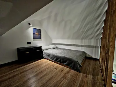Łóżko lub łóżka w pokoju w obiekcie Apartamenty nad Kamiennym Potokiem 1
