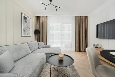 Telewizja i/lub zestaw kina domowego w obiekcie Stylowy Apartament z Balkonem i Wanną by Noclegi Renters