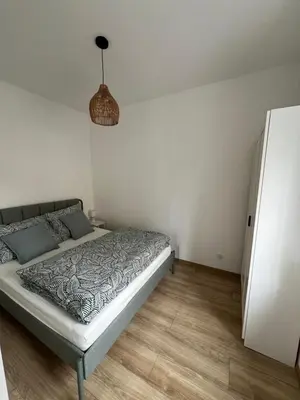 Łóżko lub łóżka w pokoju w obiekcie Apartament Popiel