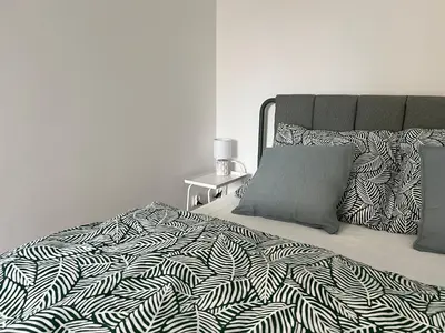 Łóżko lub łóżka w pokoju w obiekcie Apartament Popiel