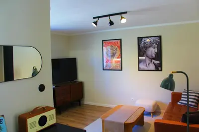 Telewizja i/lub zestaw kina domowego w obiekcie Leśne Szlaki AP Apartment's