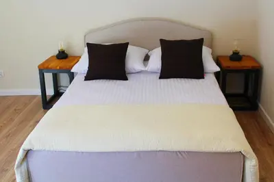 Łóżko lub łóżka w pokoju w obiekcie Leśne Szlaki AP Apartment's