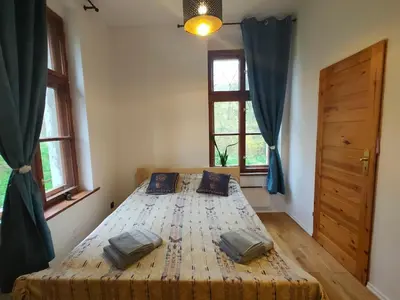 Łóżko lub łóżka w pokoju w obiekcie Akacjowy zakątek