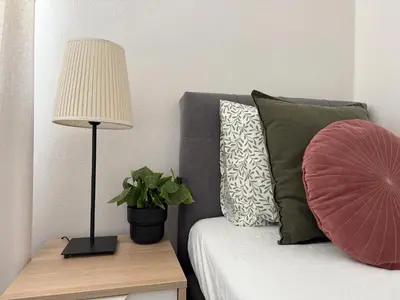 Łóżko lub łóżka w pokoju w obiekcie Szewska, HARLEM APART