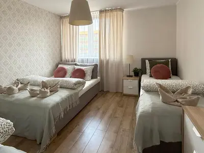 Łóżko lub łóżka w pokoju w obiekcie Szewska, HARLEM APART