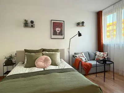 Łóżko lub łóżka w pokoju w obiekcie Szewska, HARLEM APART