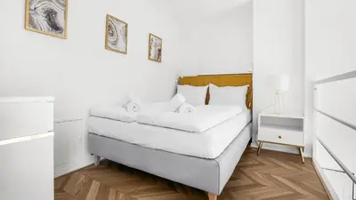 Łóżko lub łóżka w pokoju w obiekcie Bulwar Staromiejski, Sun & Snow