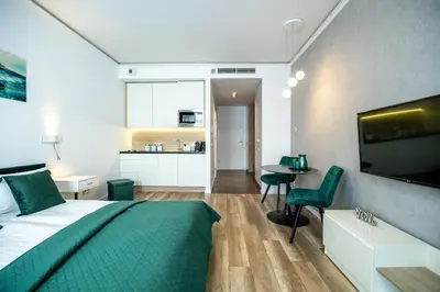 Telewizja i/lub zestaw kina domowego w obiekcie About Art Apartments - Ovo