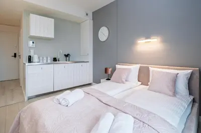 Łóżko lub łóżka w pokoju w obiekcie About Art Apartments - Ovo