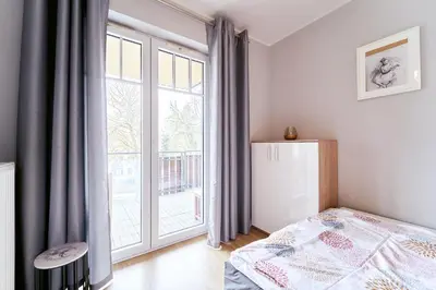Łóżko lub łóżka w pokoju w obiekcie LAGUNA Apartament Przestronny Willa Maria 19