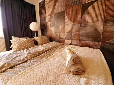 Łóżko lub łóżka w pokoju w obiekcie Apartament Słoneczny