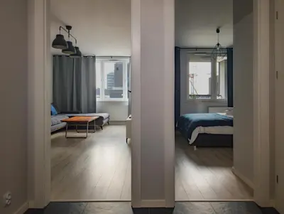 Łóżko lub łóżka w pokoju w obiekcie Wrocław Urban Chic Apartment by BookingHost