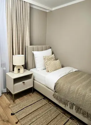 Łóżko lub łóżka w pokoju w obiekcie Apartament Lauden