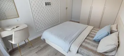 Łóżko lub łóżka w pokoju w obiekcie Art Apartaments III