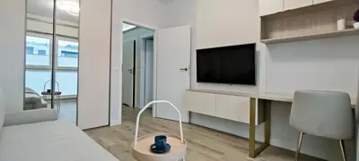 Telewizja i/lub zestaw kina domowego w obiekcie Art Apartaments III