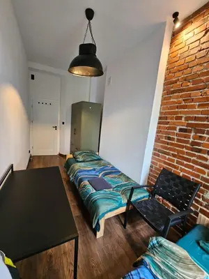 Łóżko lub łóżka w pokoju w obiekcie 7Wygodny pokoj w centrum Wroclawia