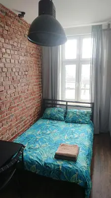 Łóżko lub łóżka w pokoju w obiekcie 9Wygodny pokoj w centrum Wroclawia