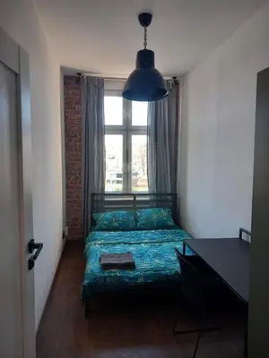 Łóżko lub łóżka w pokoju w obiekcie 10Wygodny pokoj w centrum Wroclawia