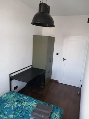 Łóżko lub łóżka w pokoju w obiekcie 10Wygodny pokoj w centrum Wroclawia