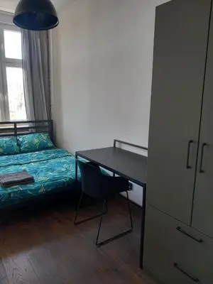 Łóżko lub łóżka w pokoju w obiekcie 10Wygodny pokoj w centrum Wroclawia