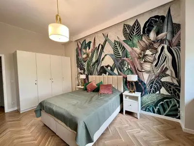 Łóżko lub łóżka w pokoju w obiekcie Tajemniczy Ogród - Secret Garden - Self check-in 24h