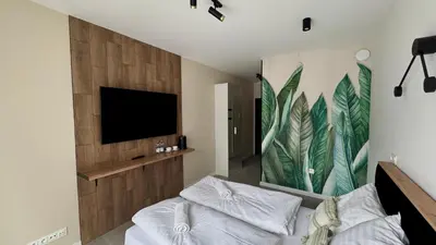 Telewizja i/lub zestaw kina domowego w obiekcie Mikroapartamenty Garden
