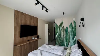 Telewizja i/lub zestaw kina domowego w obiekcie Mikroapartamenty Garden