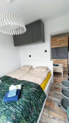 Łóżko lub łóżka w pokoju w obiekcie Wzgórze Jasia