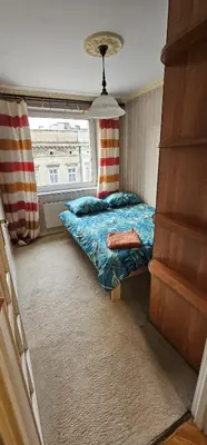 Łóżko lub łóżka w pokoju w obiekcie 13Stylowe mieszkanie w centrum miasta