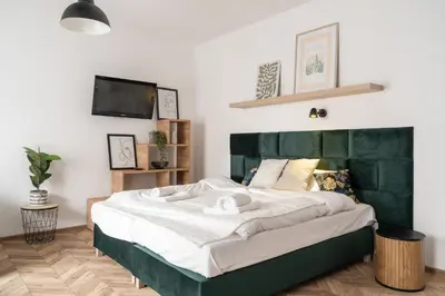 Łóżko lub łóżka w pokoju w obiekcie RentPlanet - Studio Kaszubska