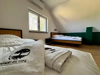 Łóżko lub łóżka w pokoju w obiekcie Agroturystyka Domki za Lipą