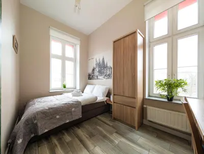 Łóżko lub łóżka w pokoju w obiekcie Wrocław Główny Comfort Apartment by BookingHost