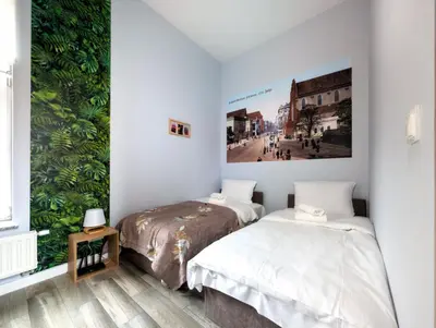 Łóżko lub łóżka w pokoju w obiekcie Wrocław Główny Comfort Apartment by BookingHost