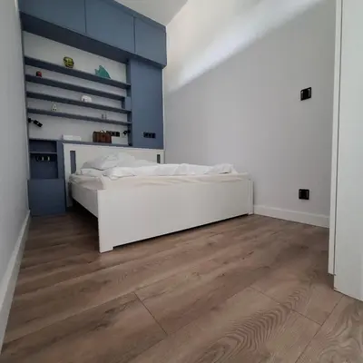 Łóżko lub łóżka w pokoju w obiekcie Century Apartment