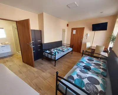 Łóżko lub łóżka w pokoju w obiekcie AE BERG Apartamenty