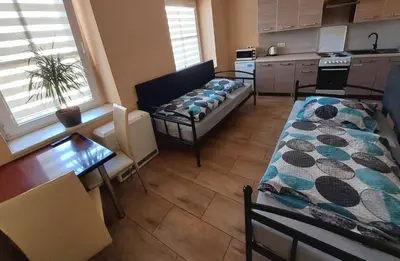 Łóżko lub łóżka w pokoju w obiekcie AE BERG Apartamenty
