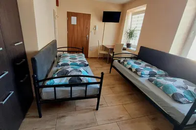Łóżko lub łóżka w pokoju w obiekcie AE BERG Apartamenty