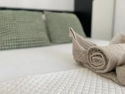 Łóżko lub łóżka w pokoju w obiekcie Legnicka Residence 65