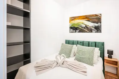 Łóżko lub łóżka w pokoju w obiekcie Legnicka Residence 65